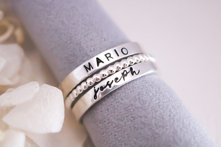 Set of 2 Sterling Silver Name Rings with 1 Spacer - Arial Font