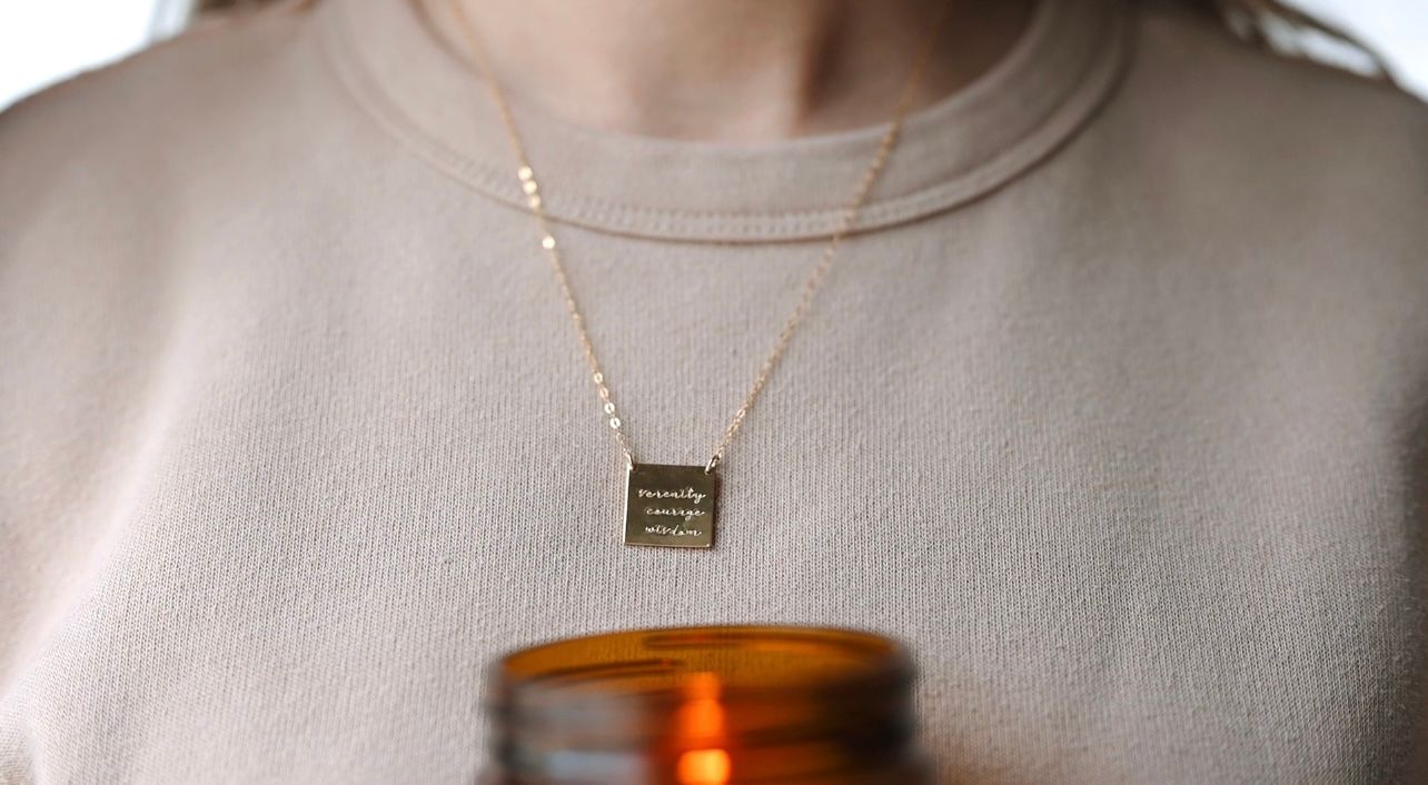 Video shows different personalized necklaces, bracelets and earrings with smiling mom and child giving it as a gift
